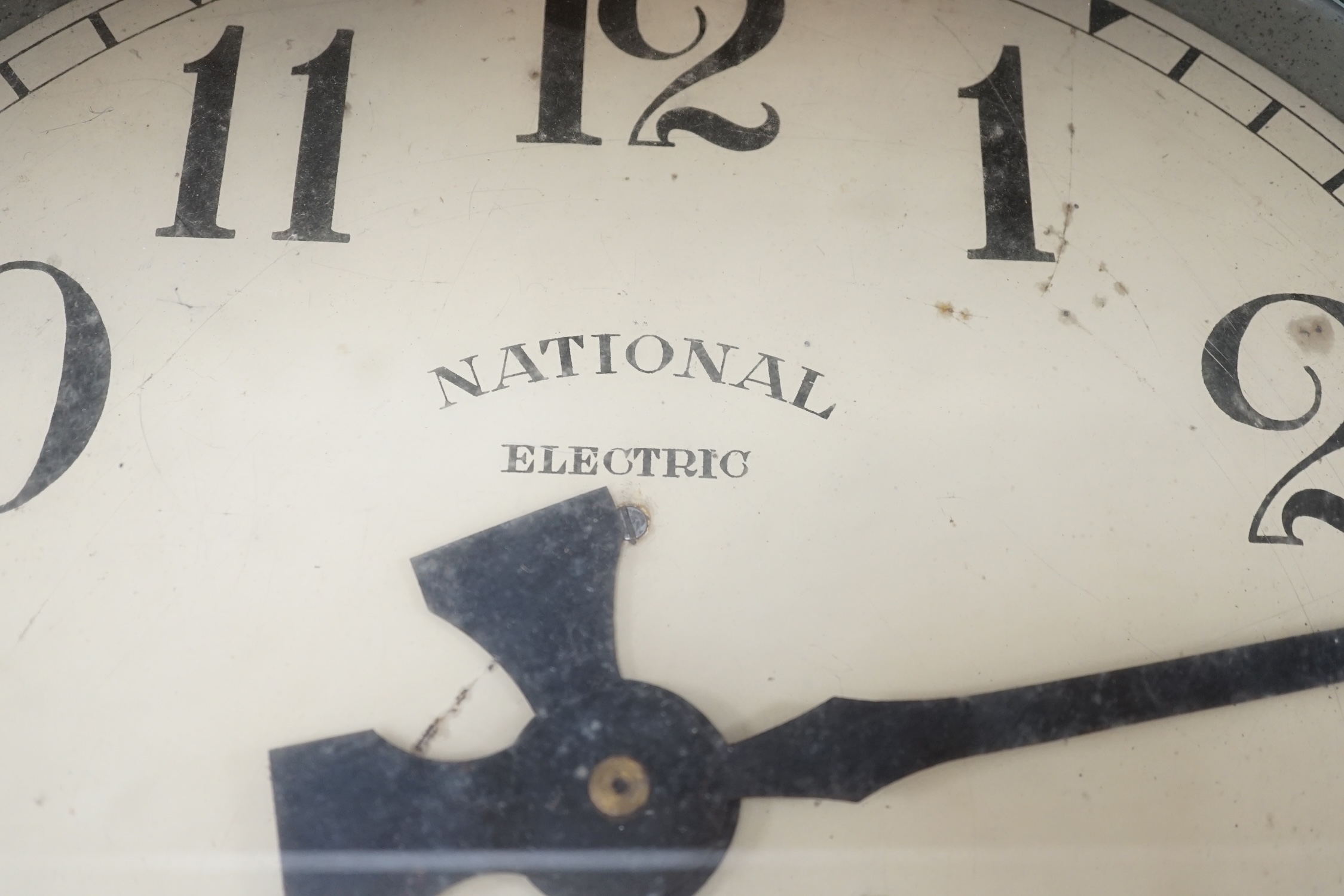 A vintage National Electric wall clock, 66cm in diameter. Condition - poor to fair